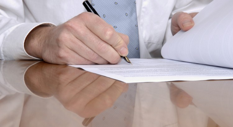 Man signing a document