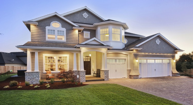 A large suburban home lit up at night