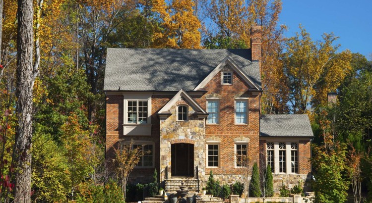 A brick house in Atlanta with a look like it's in the woods, characteristic of the look of northern Atlanta.